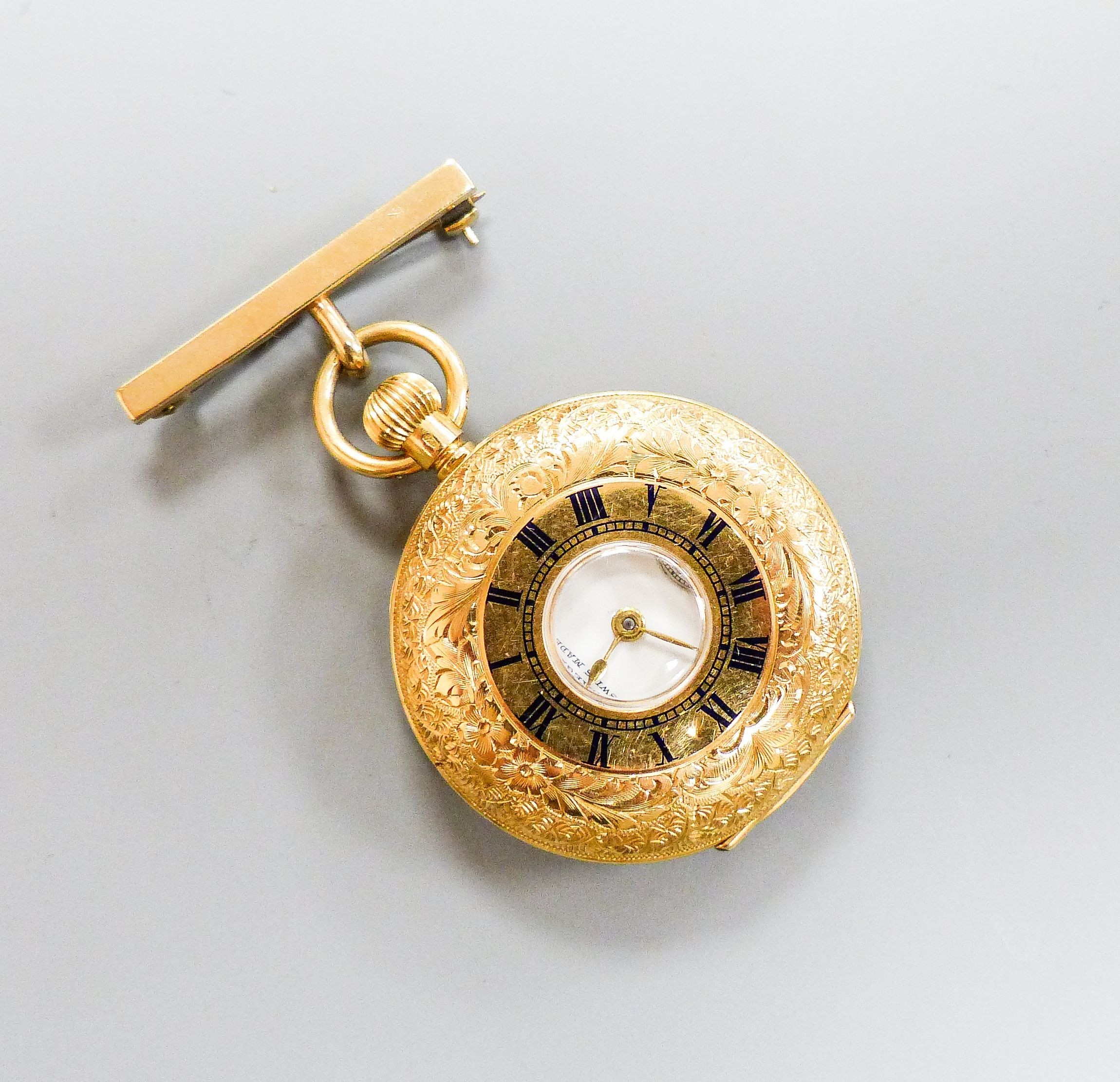 An engraved 18k Omega half hunter fob watch, cased diameter, 34mm, with a 9ct gold suspension brooch